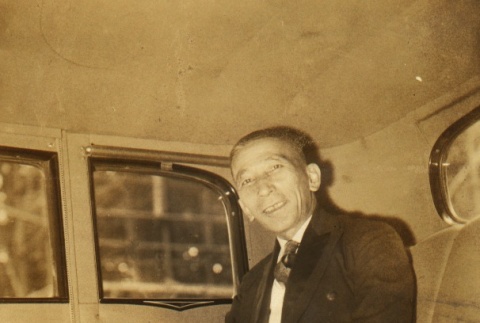 A man seated in backseat of a car (ddr-njpa-4-131)
