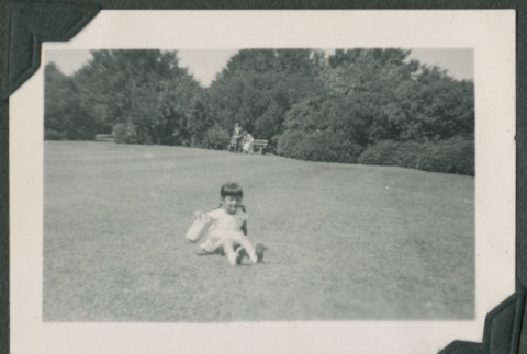 A girl playing in a field (ddr-densho-321-932)