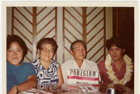 Two men and two women seated at a table (ddr-densho-426-580)