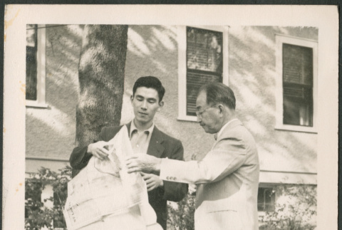 Two men with map (ddr-densho-293-167)