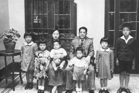 Family in their home (ddr-densho-91-4)