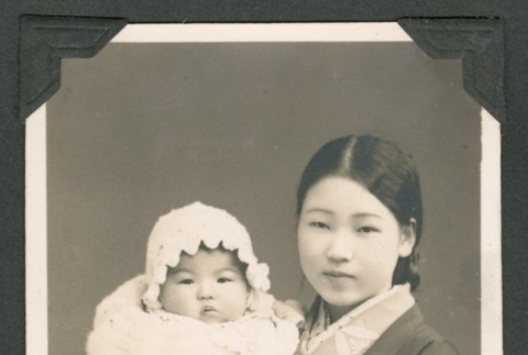 Photo of a woman in a kimono holding a baby (ddr-densho-483-265)
