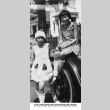 Two girls in costumes by car (ddr-ajah-6-505)