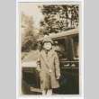 Girl standing in front of car (ddr-densho-383-402)