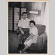 Couple sitting on chair (ddr-densho-522-64)