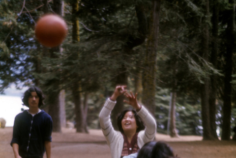 Lynn Tomioka shooting the basketball (ddr-densho-336-832)