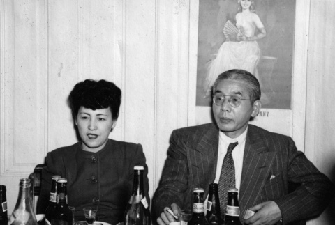 Rev. Joshin and Yukiko Motoyoshi sitting at banquet table (ddr-ajah-6-96)