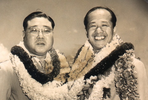 Matsutaro Kawaguchi and another man posing with leis (ddr-njpa-4-558)