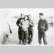 Three soldiers with woman (ddr-densho-1007-764)