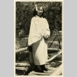 Woman wearing a graduation cap and gown (ddr-manz-6-25)