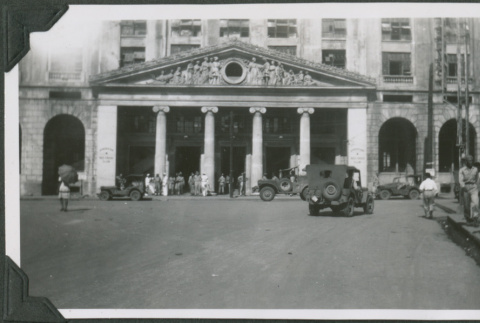 Large building with jeeps in front (ddr-ajah-2-692)