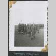 Men in overcoats walking in field (ddr-densho-434-91)