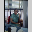 Woman sitting at desk, eating (ddr-densho-426-740)