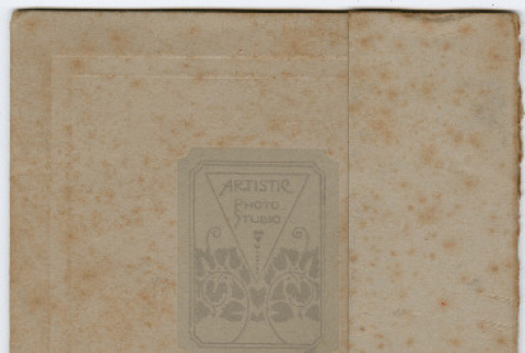 Photo of baby in folded holder, includes loose photo of baby in stroller (ddr-densho-426-1359)