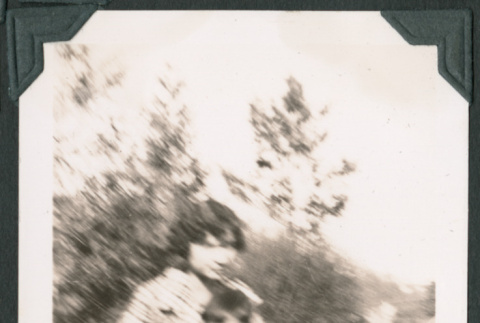 Blurry photo of a woman holding a child (ddr-densho-483-946)