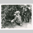 Crowd of soldiers surrounding David Quaid (ddr-densho-1007-331)
