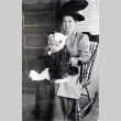 Woman holding child sitting in rocking chair (ddr-densho-474-216)