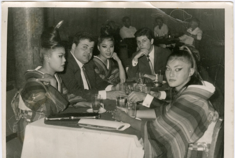 Three women and two men seated in restaurant (ddr-densho-426-818)