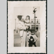 Photo of a man with two children (ddr-densho-483-795)