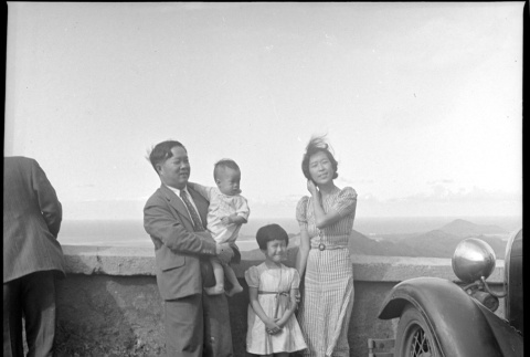 Family standing at viewpoint (ddr-densho-426-250)