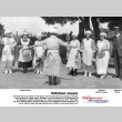 Group of women in aprons and bonnets beating on pots and pans (ddr-ajah-3-345)