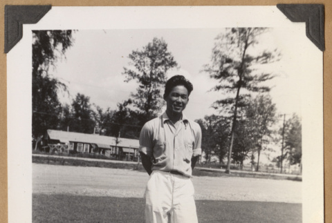 Gary Kikawa on a lawn (ddr-densho-542-143)