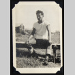 Man seated on a bench (ddr-densho-542-738)