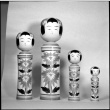 Four wooden figures on display (ddr-densho-426-2212)