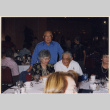 Three people at banquet table (ddr-densho-466-566)
