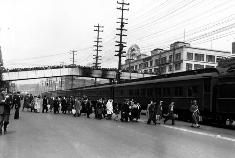 Japanese Americans boarding train for Manzanar, California (ddr-densho-36-15)