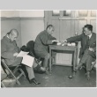 Tojo and two other men being tried for war crimes wait (ddr-densho-299-156)