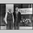 Father and son in front of store (ddr-densho-151-272)
