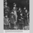 Mochida family ready to board a bus to an assembly center (ddr-csujad-7-6)