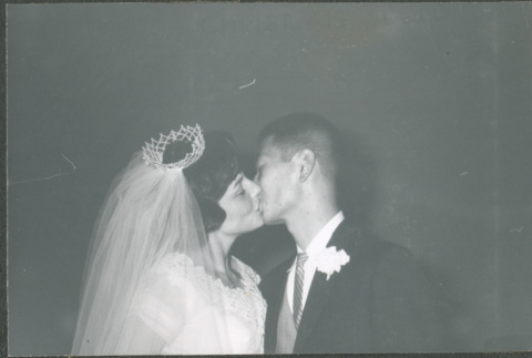 Bride and groom kissing (ddr-densho-523-343)