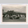 Small group of funeral attendees with casket (ddr-densho-475-298)