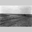 A worker bulldozing an agricultural field (ddr-fom-1-2)