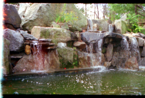 Rock waterfall in pond (ddr-densho-377-2327)