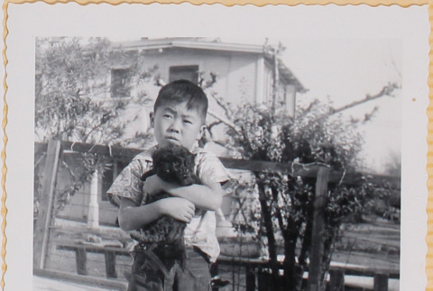 William Shiomi with puppy (ddr-densho-522-206)