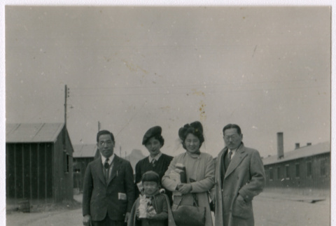 Two men, two women, and a girl with stuffed bunny (ddr-densho-362-56)