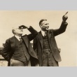 Two men looking at something outside (ddr-njpa-1-2560)