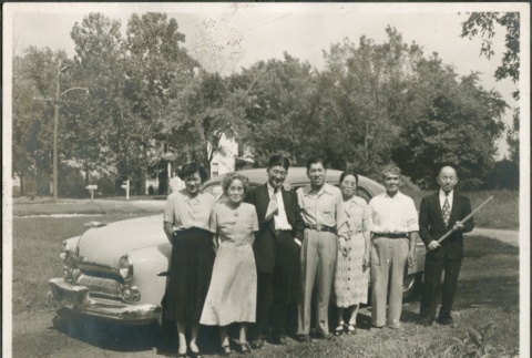 A group standing in front of a car (ddr-densho-316-44)