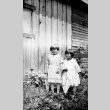 Two sisters in front of a house (ddr-densho-18-16)