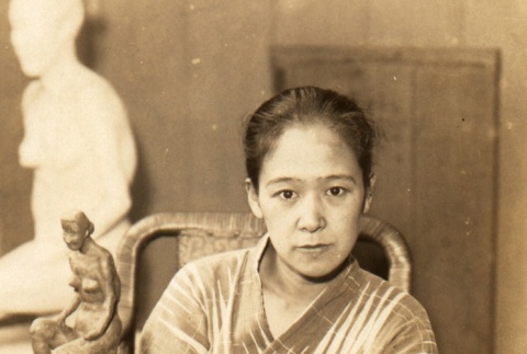 A sculptor posing in her workshop (ddr-njpa-4-1905)