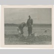 Couple digging at beach (ddr-densho-326-38)