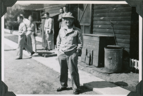 Man standing outside camp building (ddr-ajah-2-539)