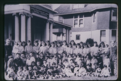 (Slide) - Image of nuns and children outside Maryknoll (ddr-densho-330-10-mezzanine-4462e1885f)