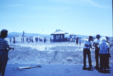 Pilgrims visiting structures on the original site of Tule Lake concentration camp (ddr-densho-294-49)