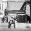 Men framing addition to building (ddr-densho-426-2160)