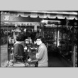 Tomoye (Nozawa) Takahashi and Martha (Nozawa) Tsuchida Suzuki outside shop (ddr-densho-426-2320)