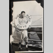 Man with life ring on board ship, wearing baseball uniform (ddr-densho-326-365)